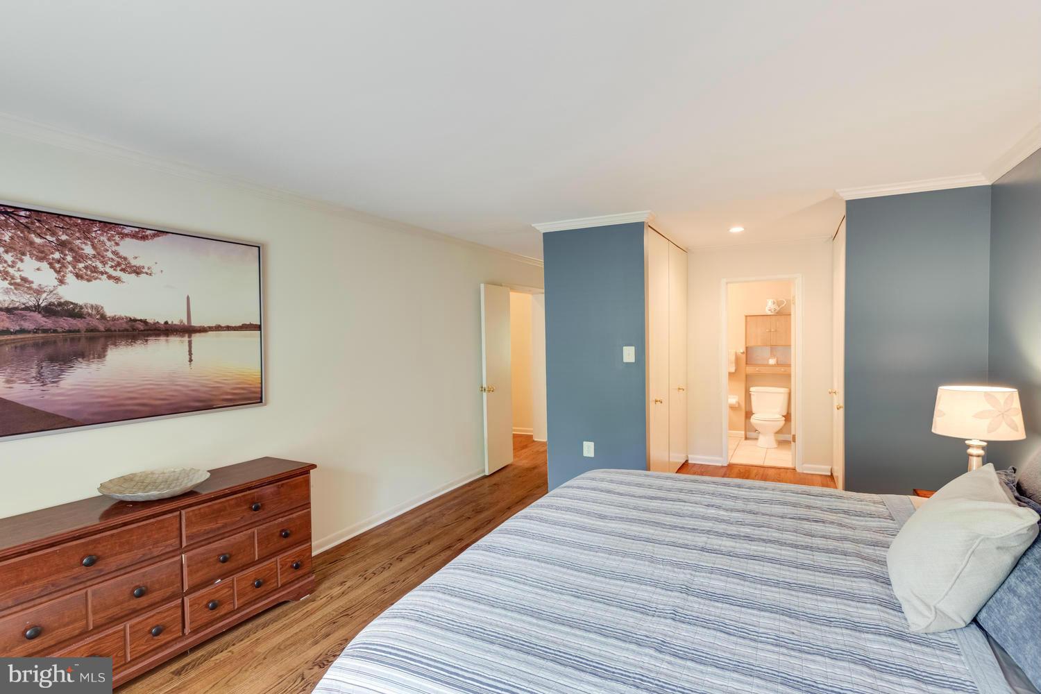1547 Inlet Court Reston, VA 20190 - Photo 17 of 30 a bedroom with a bed and a lamp on dresser