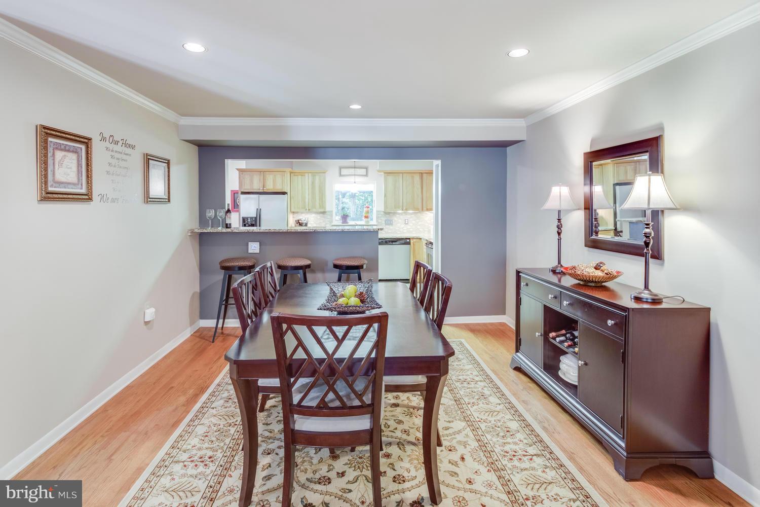 1547 Inlet Court Reston, VA 20190 - Photo 7 of 30 a view of a dining room with furniture window and wooden floor