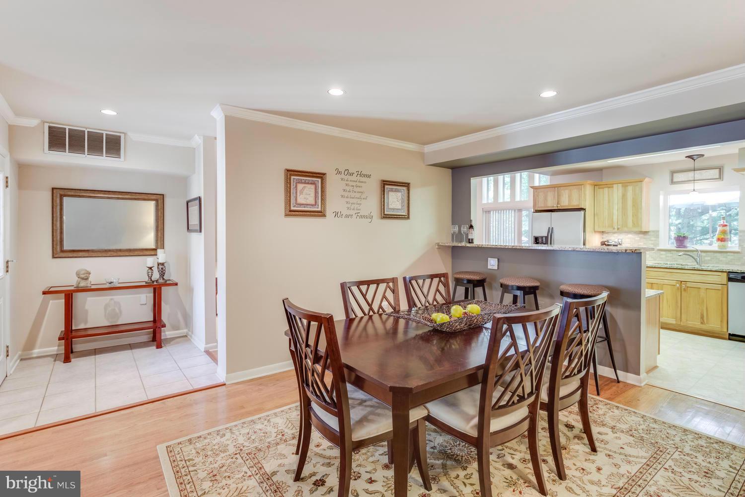 1547 Inlet Court Reston, VA 20190 - Photo 8 of 30 a view of a dining room with furniture and a window