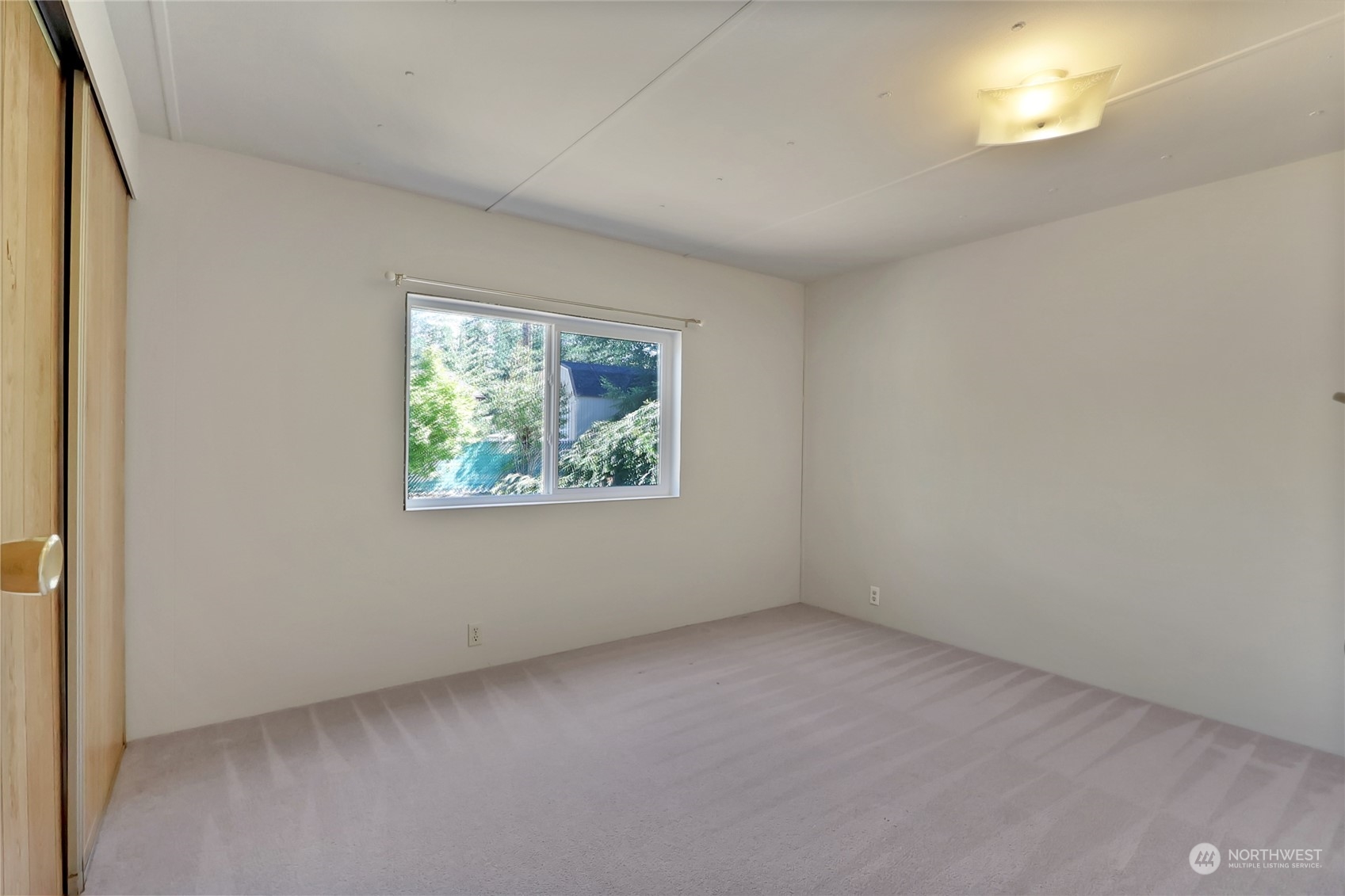 5334 254th Street East Graham, WA 98338 - Photo 13 of 33 an empty room with a window