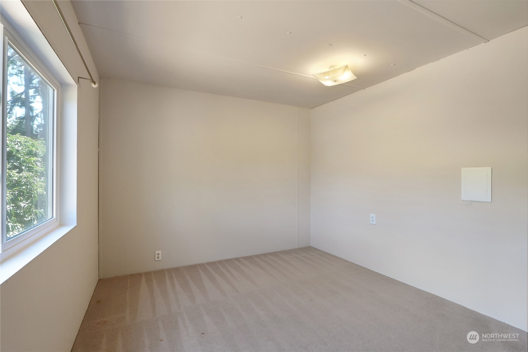 5334 254th Street East Graham, WA 98338 - Photo 14 of 33 an empty room with a empty space and window