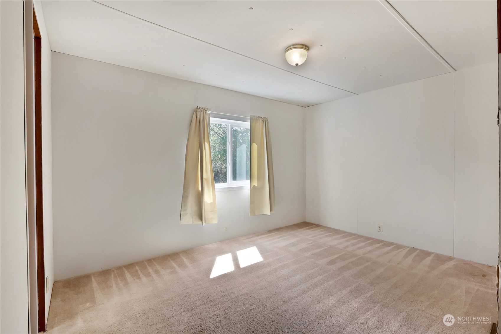 5334 254th Street East Graham, WA 98338 - Photo 15 of 33 an empty room with windows