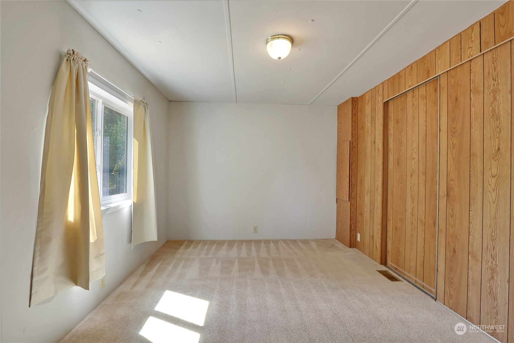 5334 254th Street East Graham, WA 98338 - Photo 16 of 33 a view of an empty room and window