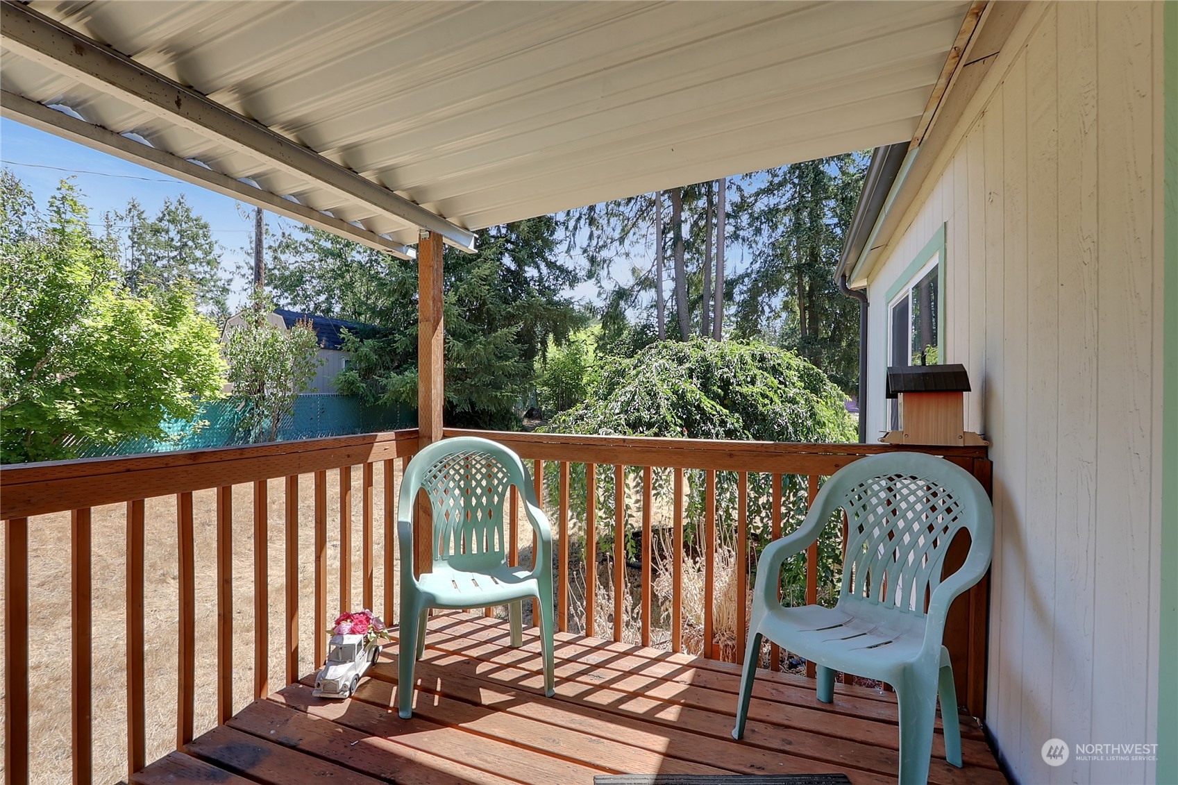 5334 254th Street East Graham, WA 98338 - Photo 18 of 33 a view of a chair in wooden deck