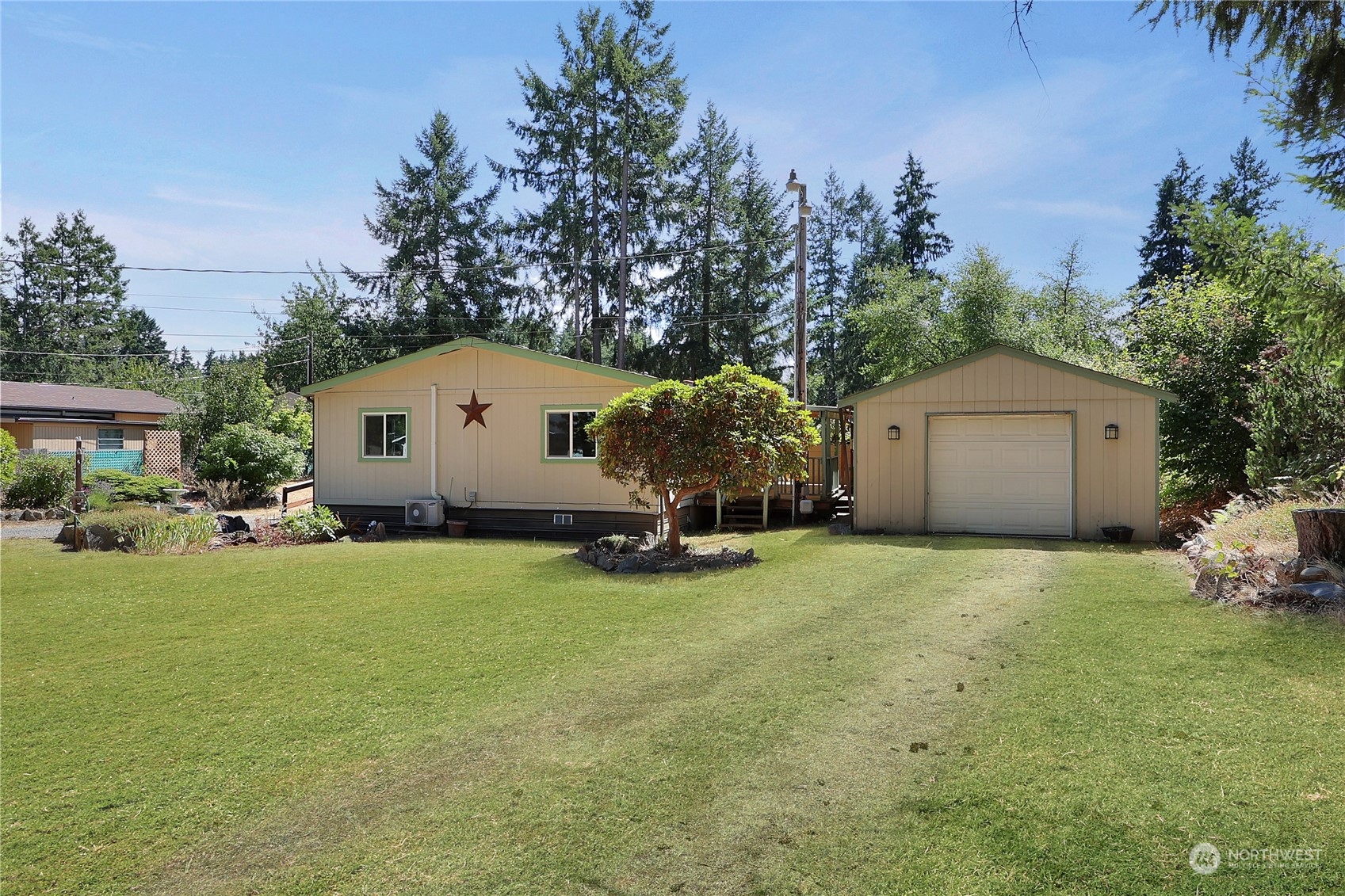 5334 254th Street East Graham, WA 98338 - Photo 2 of 33 a house with garden in front of it
