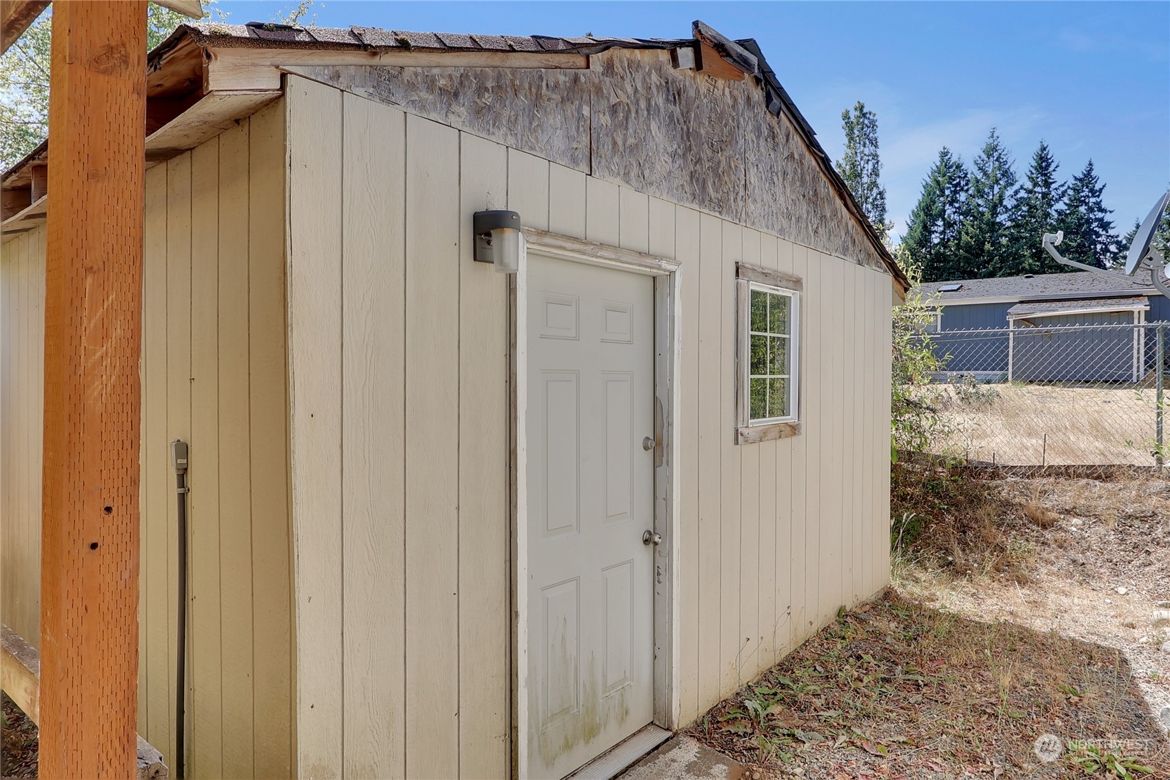 5334 254th Street East Graham, WA 98338 - Photo 21 of 33 a view of a house with a wooden door