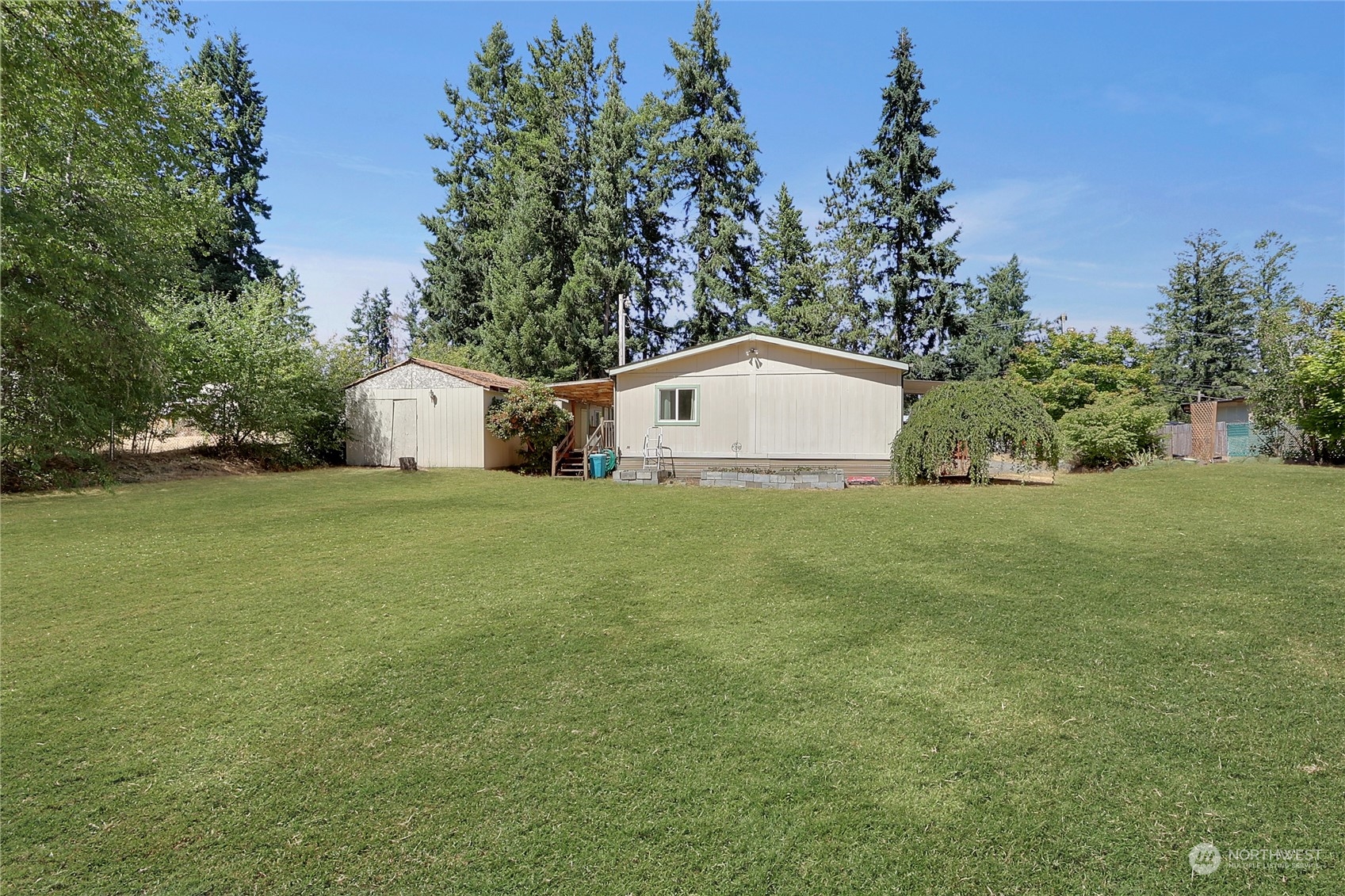 5334 254th Street East Graham, WA 98338 - Photo 24 of 33 a view of a house with backyard