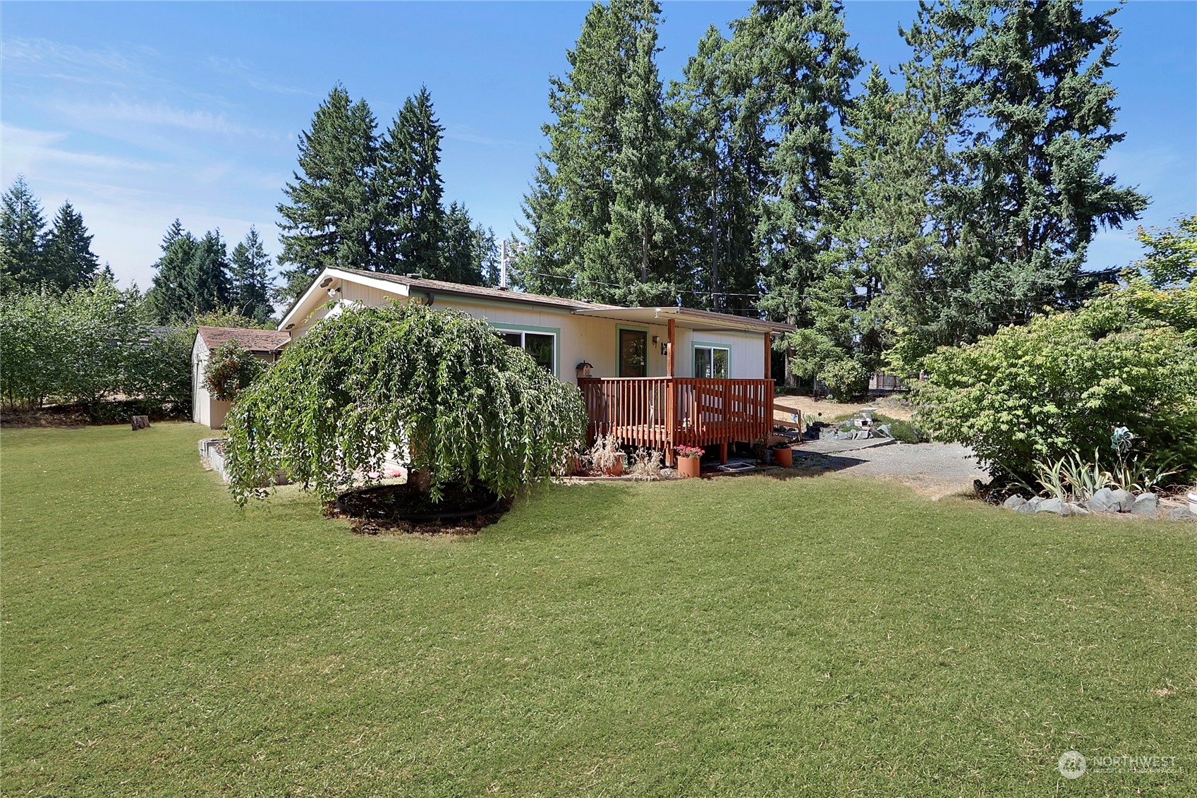 5334 254th Street East Graham, WA 98338 - Photo 26 of 33 a view of a house with backyard and garden