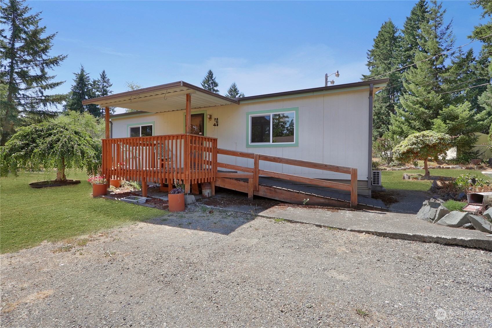 5334 254th Street East Graham, WA 98338 - Photo 27 of 33 a view of a house with a yard and wooden fence