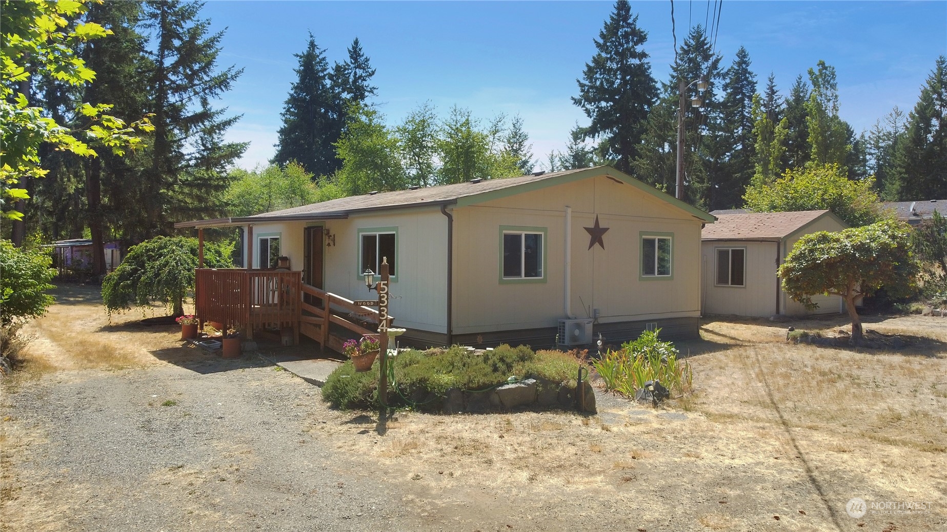 5334 254th Street East Graham, WA 98338 - Photo 28 of 33 a view of a house with a yard