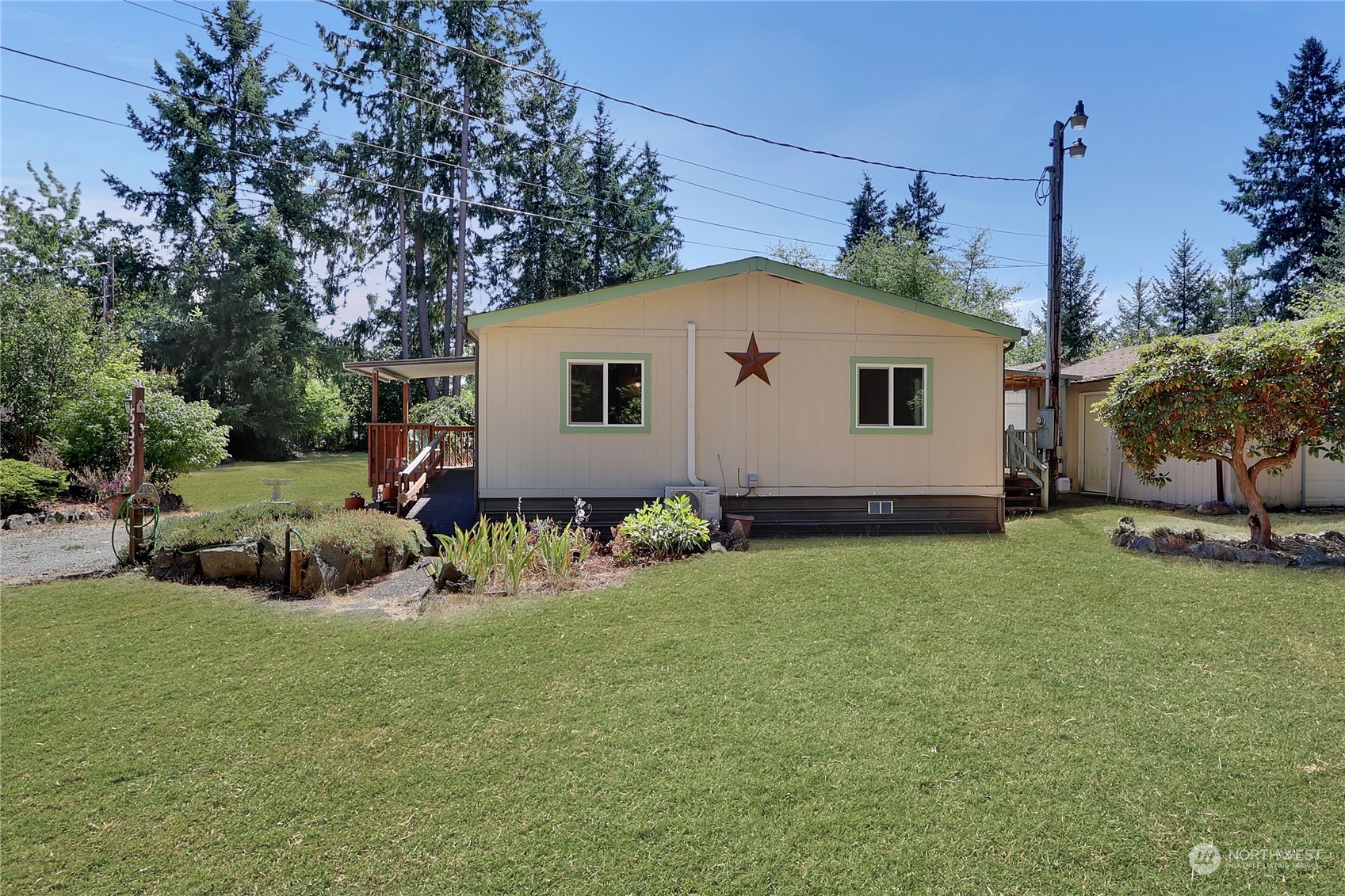 5334 254th Street East Graham, WA 98338 - Photo 29 of 33 a view of a house with a yard