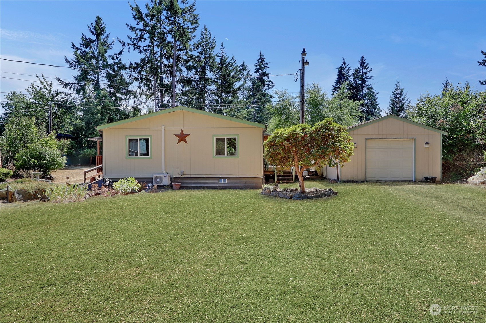 5334 254th Street East Graham, WA 98338 - Photo 30 of 33 a view of a house with backyard and garden