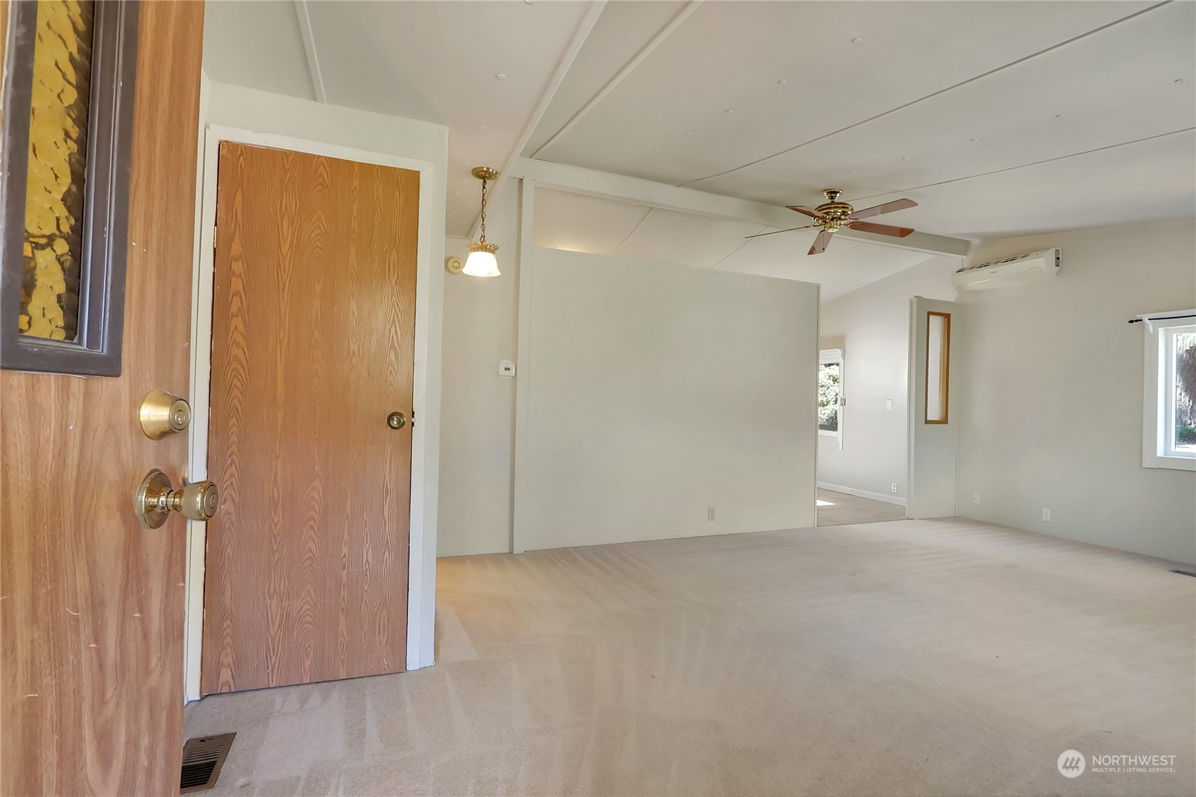 5334 254th Street East Graham, WA 98338 - Photo 3 of 33 an empty room with windows and closet