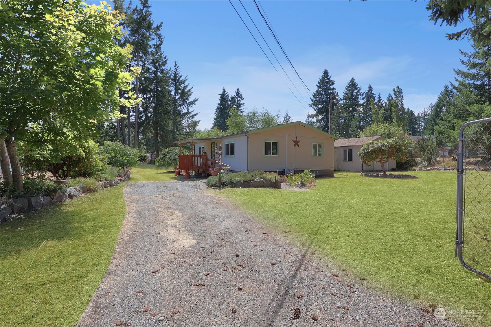 5334 254th Street East Graham, WA 98338 - Photo 31 of 33 a view of a house with a yard