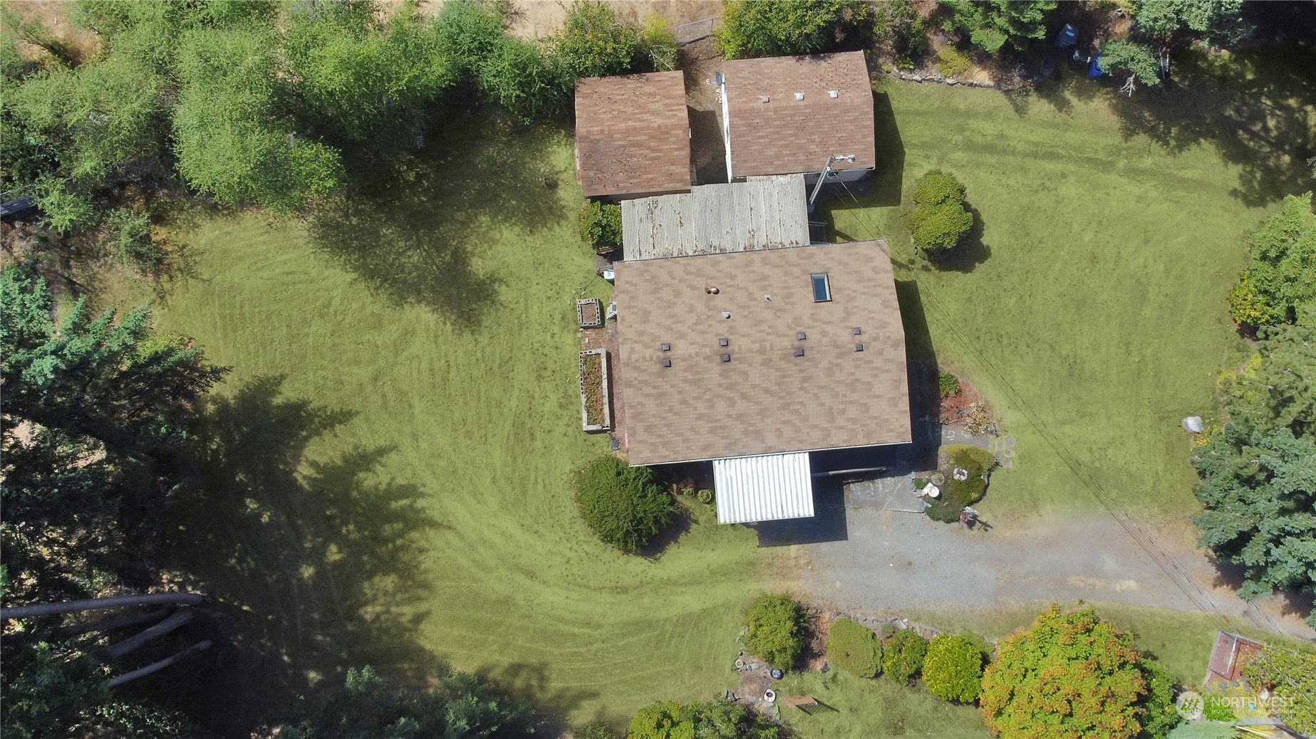 5334 254th Street East Graham, WA 98338 - Photo 32 of 33 an aerial view of a house with pool yard and outdoor seating