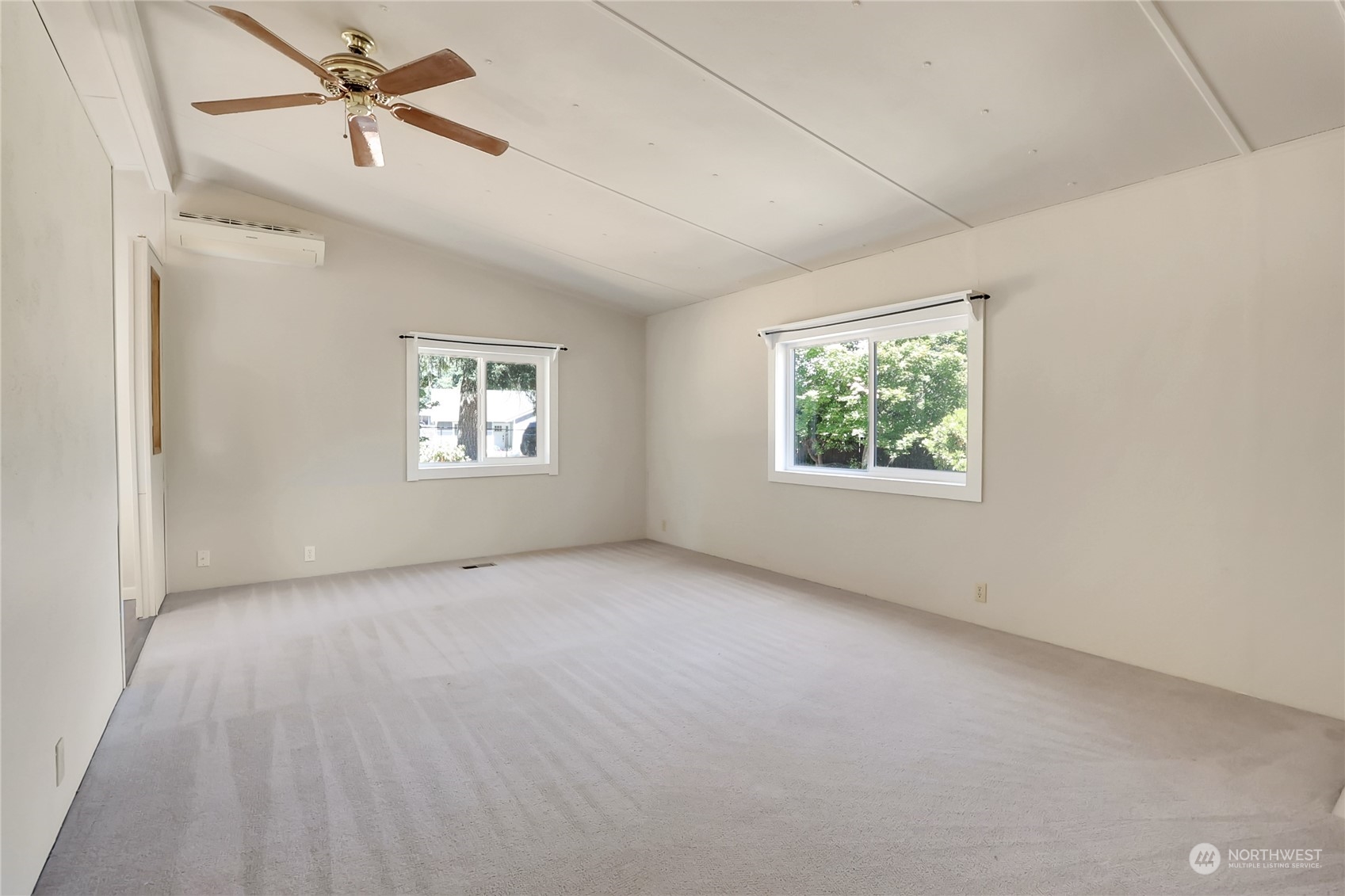 5334 254th Street East Graham, WA 98338 - Photo 4 of 33 a view of an empty room with a window