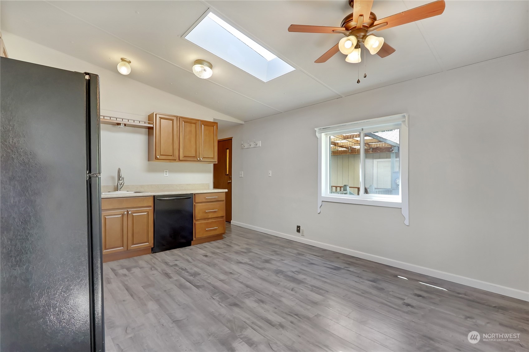 5334 254th Street East Graham, WA 98338 - Photo 7 of 33 a view of a kitchen with a sink and a microwave