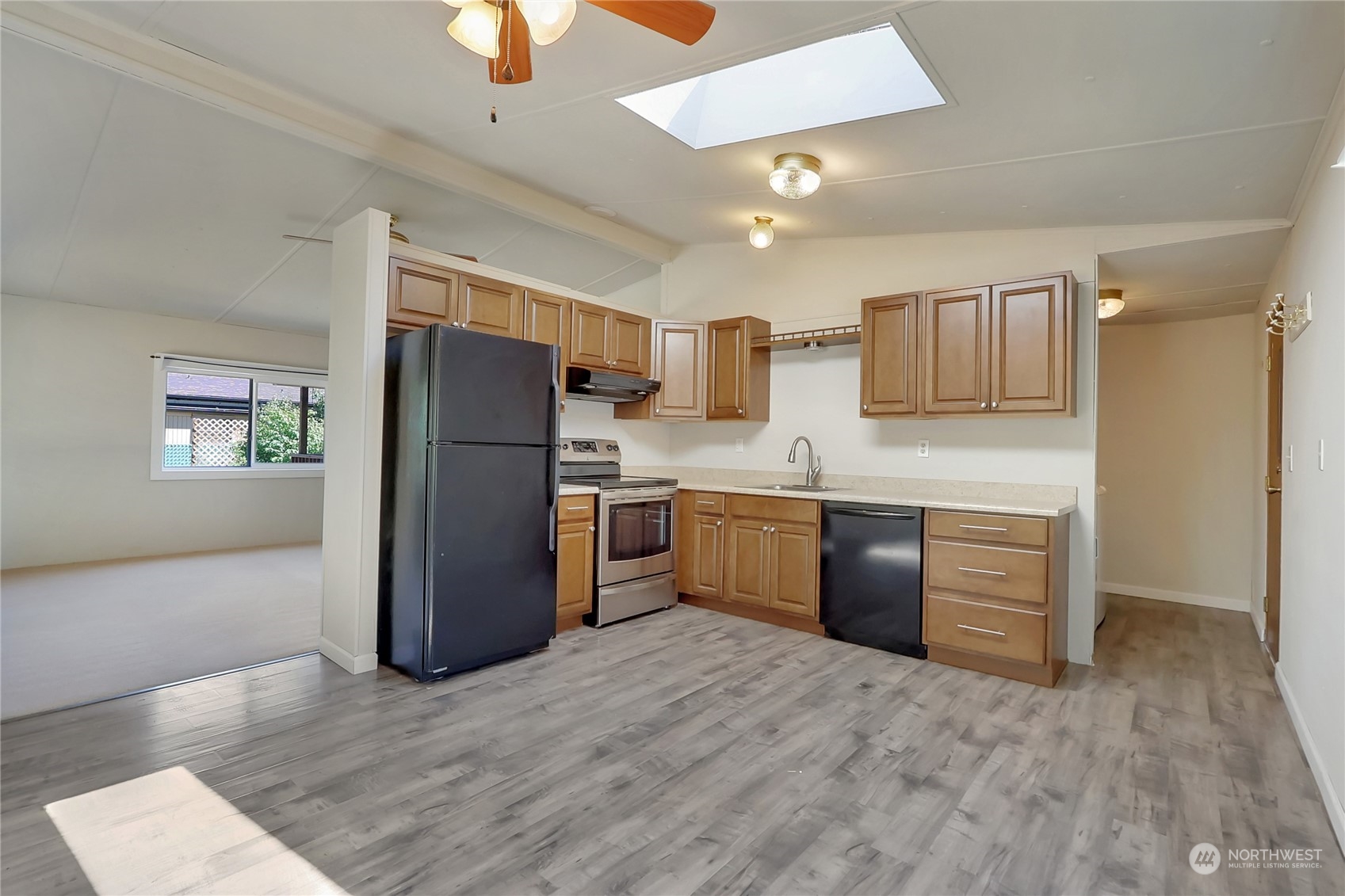 5334 254th Street East Graham, WA 98338 - Photo 8 of 33 a kitchen with a refrigerator and a sink