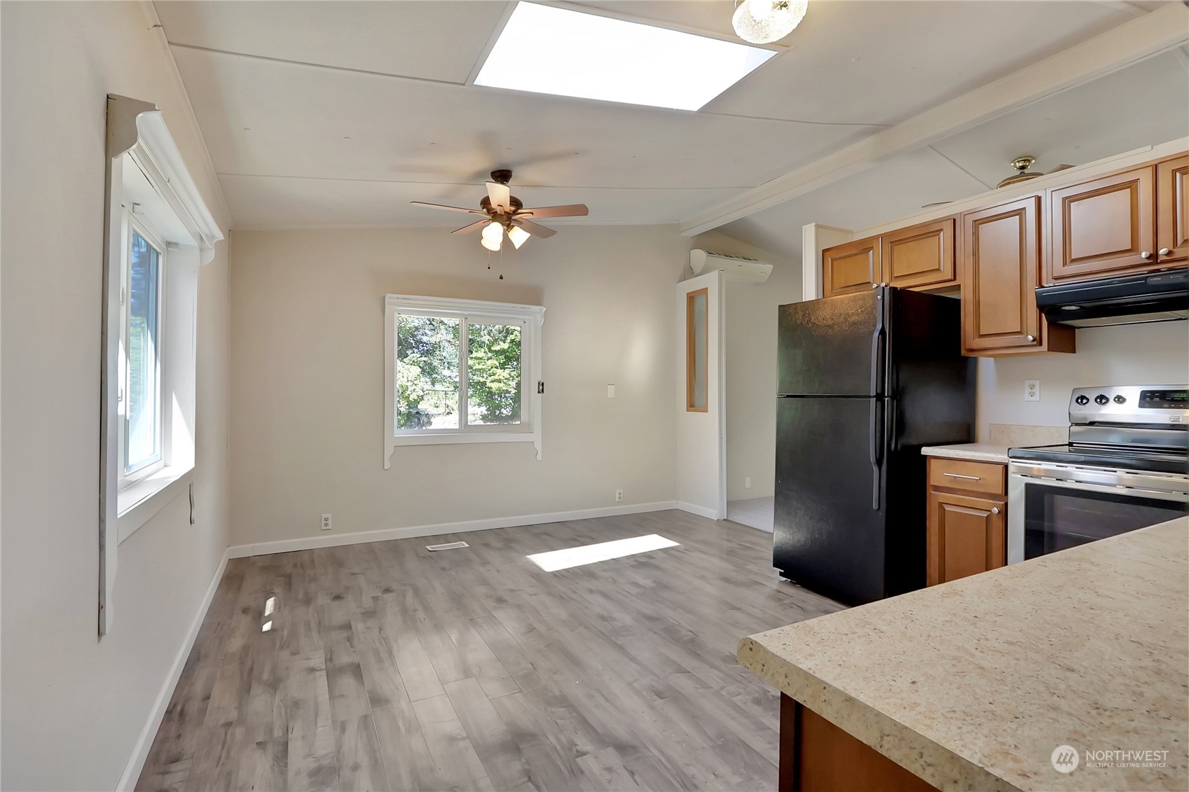 5334 254th Street East Graham, WA 98338 - Photo 10 of 33 a kitchen with stainless steel appliances a refrigerator sink and stove