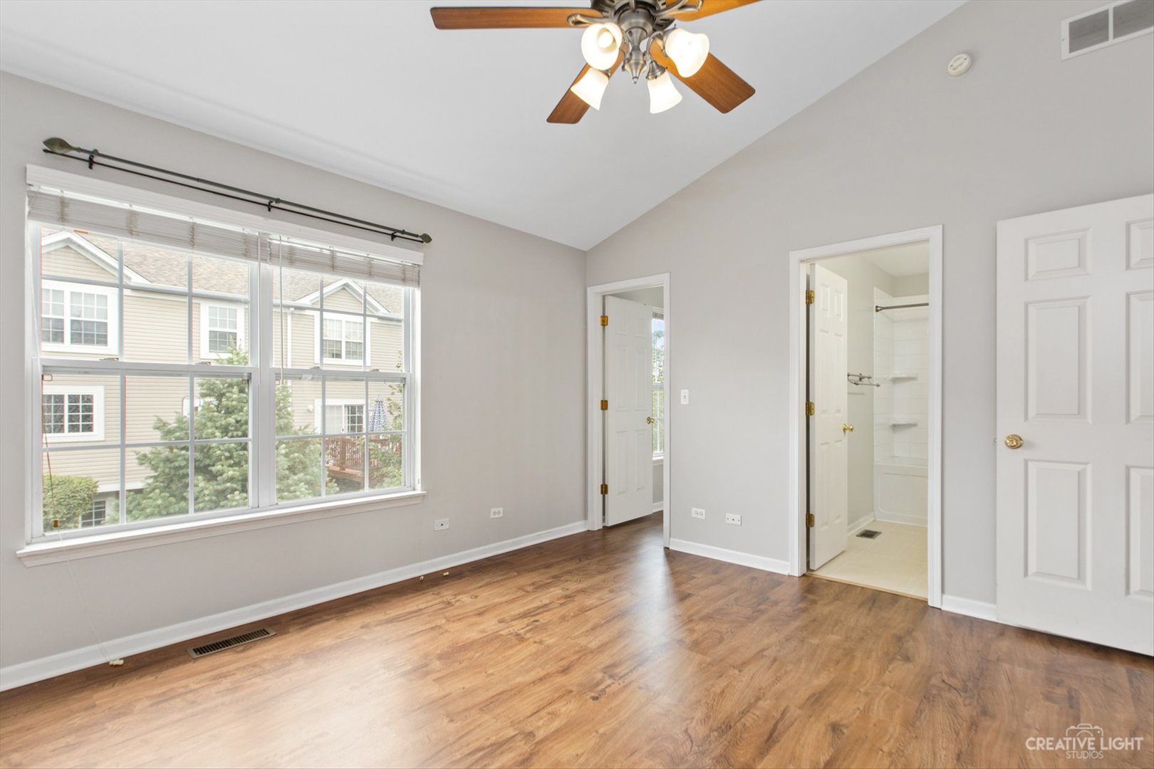 511 Declaration Lane Aurora, IL 60502 - Photo 12 of 17 a view of an empty room with a window and wooden floor