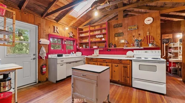 a kitchen with a stove and cabinets