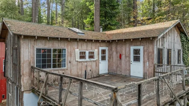 a view of a house with a tub and wooden stairs