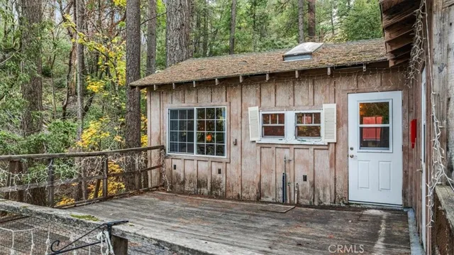 a view of a house with a tub and wooden stairs
