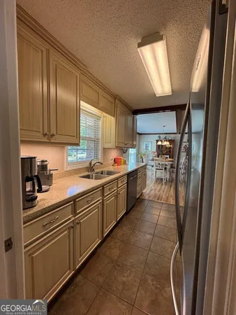 a view of a dining room with furniture and window