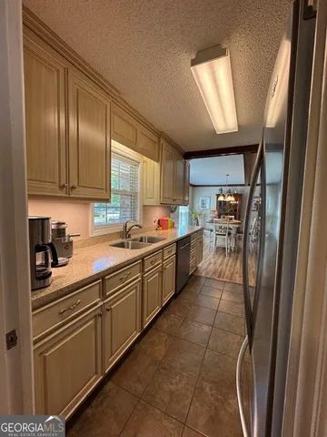 a view of a dining room with furniture and window