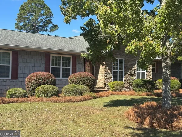 a bedroom with bed and a window