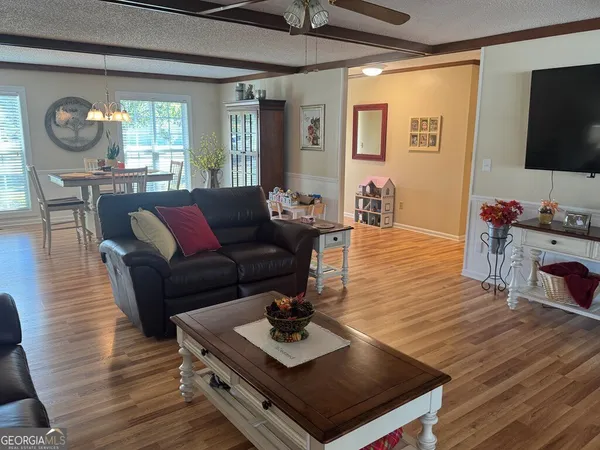 a bathroom with a sink and mirror with toilet