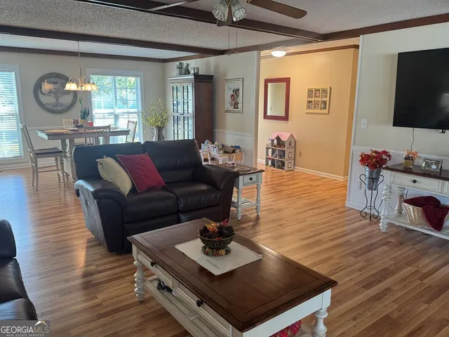a bathroom with a sink and mirror with toilet