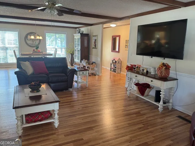a bedroom with a bed and flat screen tv