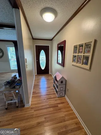 a kitchen with a sink a stove and cabinets