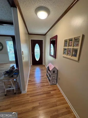 a kitchen with a sink a stove and cabinets