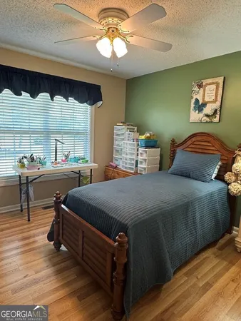 a swimming pool with outdoor seating and yard