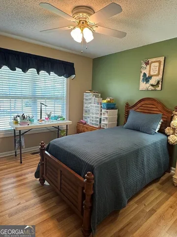 a swimming pool with outdoor seating and yard