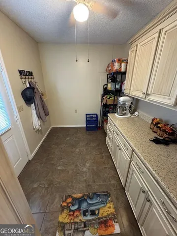 a kitchen with a stove a sink and a refrigerator