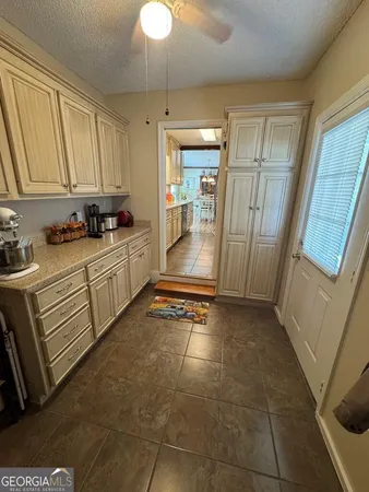 a view of a dining room with furniture and window