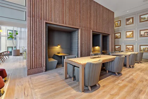 a kitchen that has a table and chairs in it