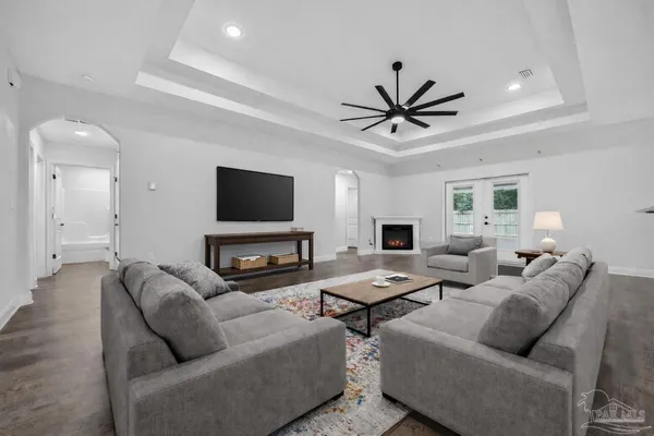 a living room with furniture and a flat screen tv
