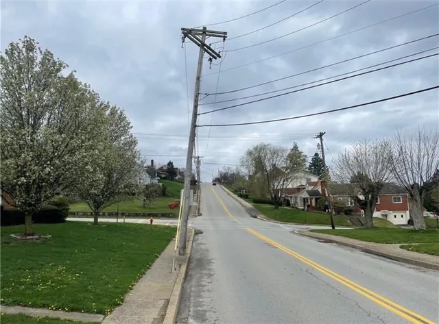a view of a street with a building in the background