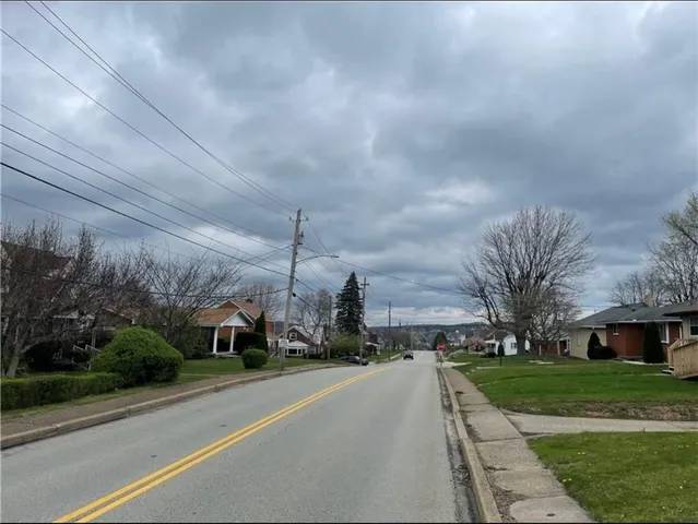 a view of a city street from a building