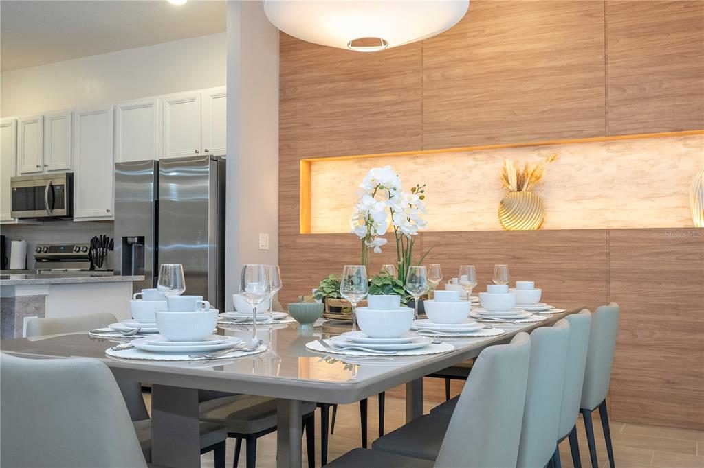 10018 Voyager Way Orlando, FL 32821 - Photo 29 of 100 a view of a dining room with furniture window and outside view