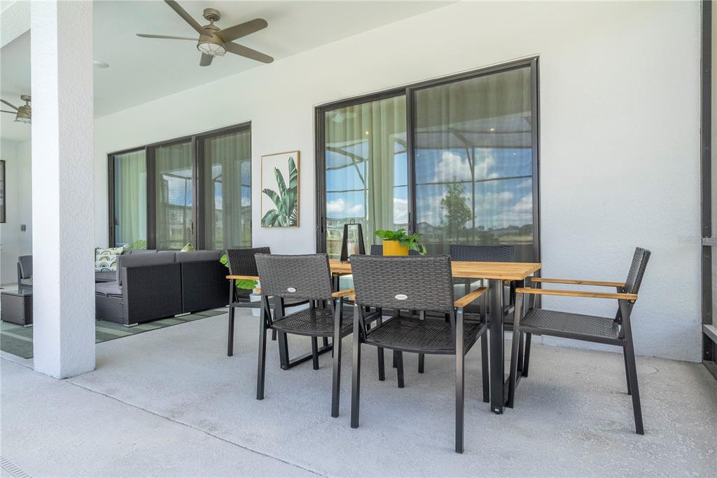 10018 Voyager Way Orlando, FL 32821 - Photo 39 of 100 a view of a dining room with furniture window and outside view