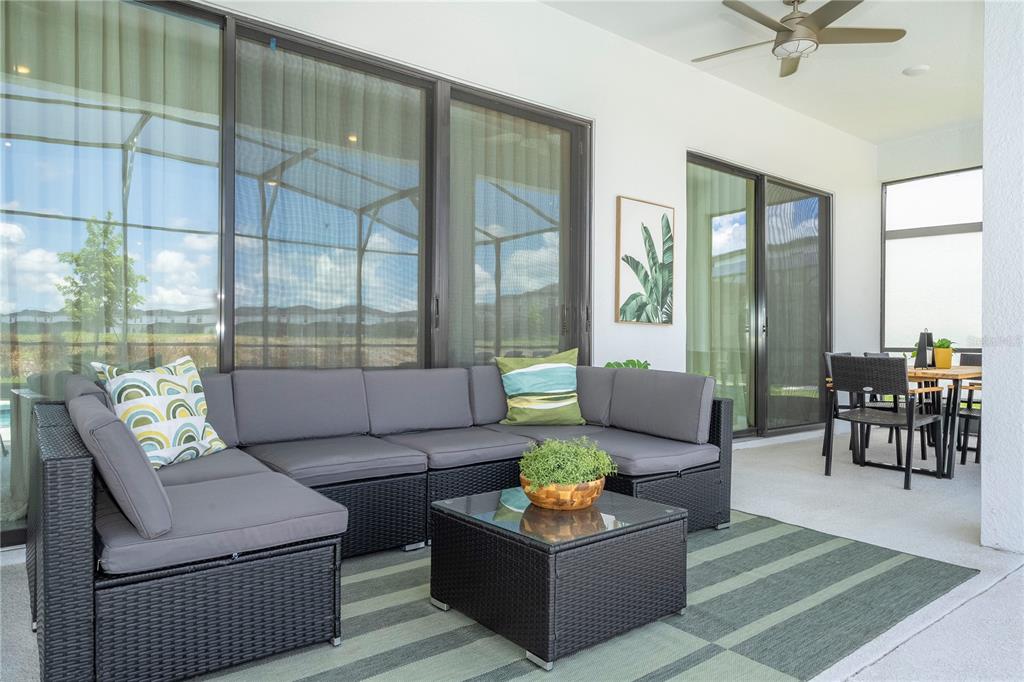 10018 Voyager Way Orlando, FL 32821 - Photo 40 of 100 a living room with furniture and a window