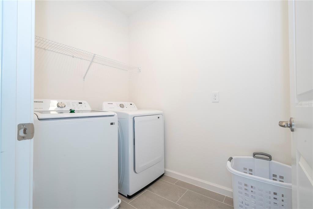 10018 Voyager Way Orlando, FL 32821 - Photo 66 of 100 a utility room with dryer and washer