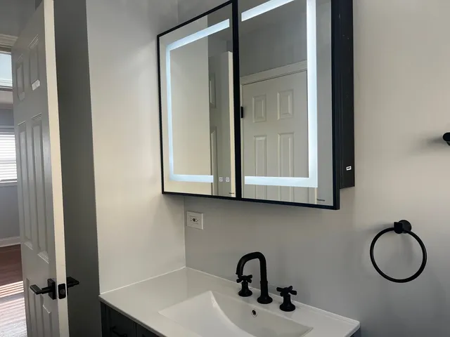 a bathroom with a sink and a mirror