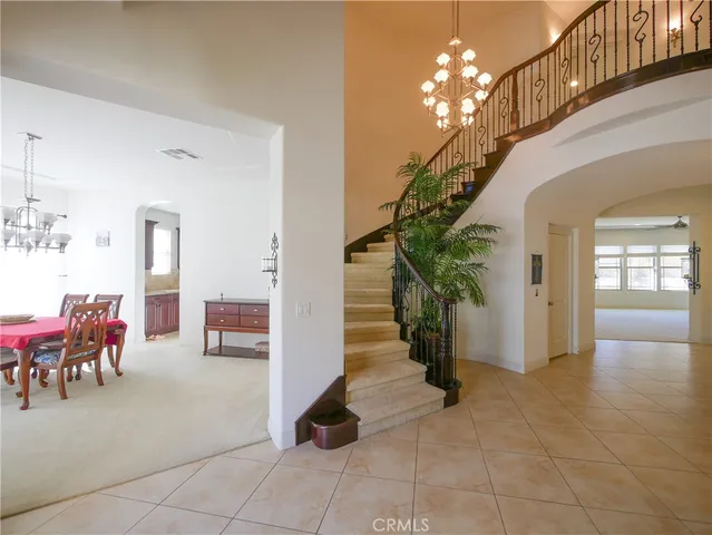 a kitchen with kitchen island granite countertop stainless steel appliances a sink counter top space cabinets and a window