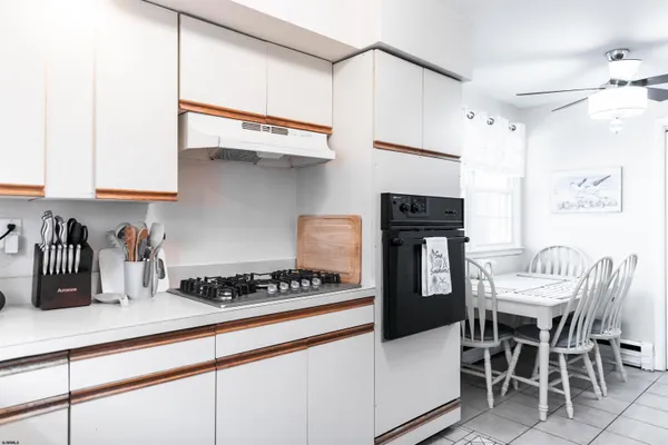 a kitchen with stainless steel appliances a sink stove and refrigerator